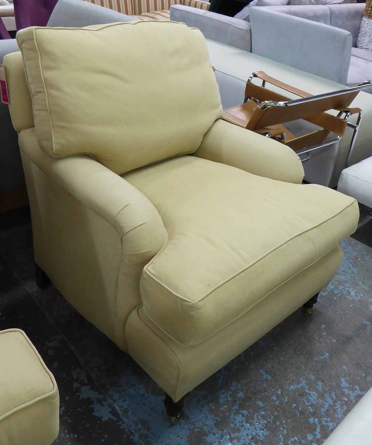 ARMCHAIR, Howard style in beige fabric on turned castor supports, 78cm W.