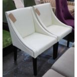 CHAIRS, a pair, cream leather with chrome studs ring to back on darkwood legs.