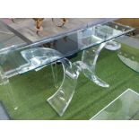 CONSOLE TABLE, with glass top on a curved lucite base in the style of lion in frost,