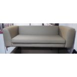 SOFA, contemporary design, having a long seat cushion in grey upholstery on chrome legs,
