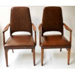 ARMCHAIRS, a pair, 1970's Danish style teak framed and mid brown studded leather upholstery.