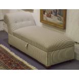 DAYBED OTTOMAN, ticking upholstered with hinged seat on castors, 168cm L x 60cm.