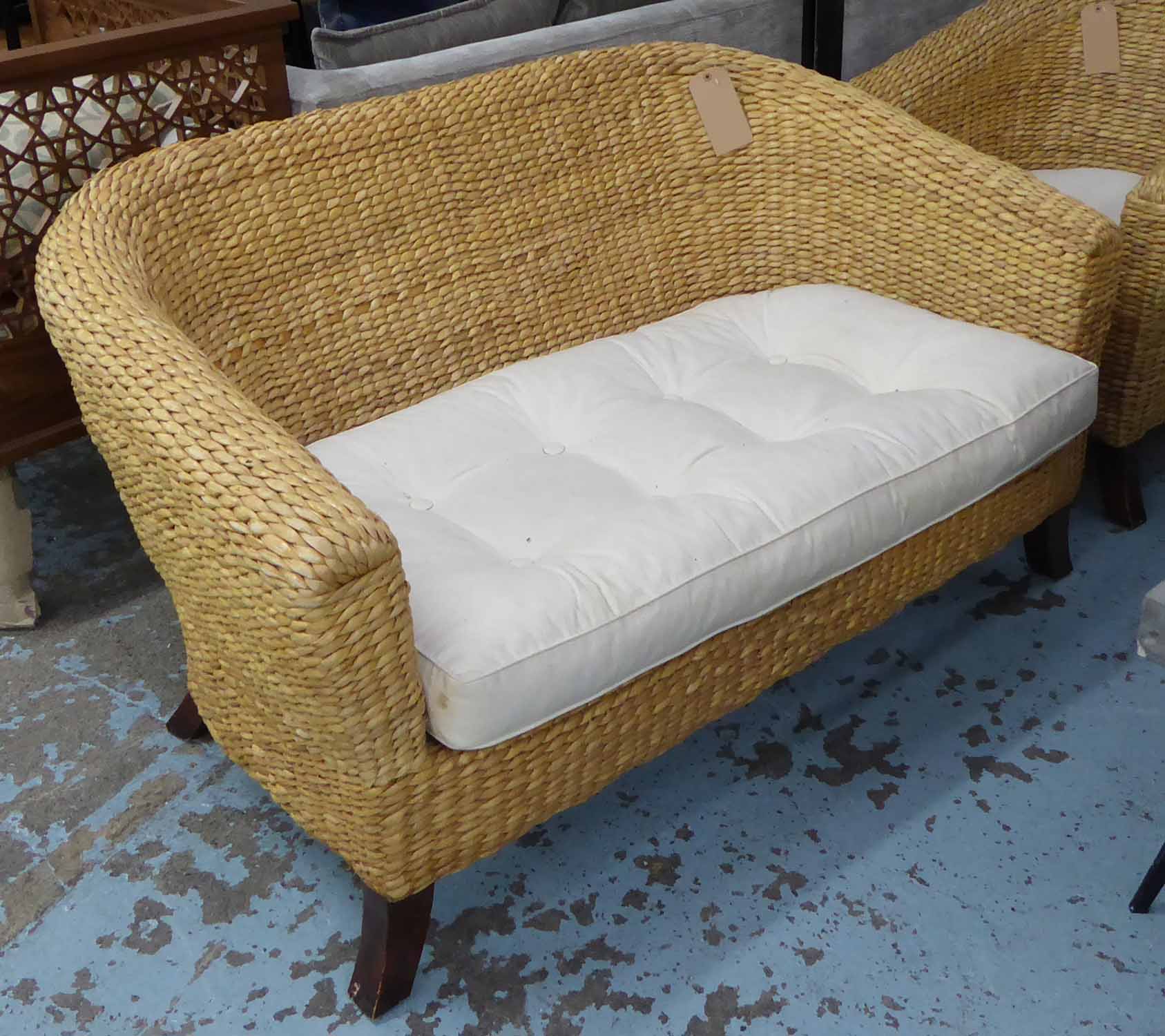 CONSERVATORY WICKER SOFA, rounded back on splayed legs,