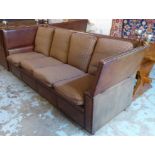 KNOLE SOFA, of substantial proportions, brown leather with studded detail and striped cushions,