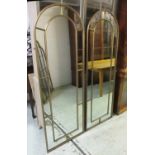 GARDEN MIRRORS, a pair, gilt metal framed, each with an arched top, 64cm W x 180cm H.