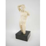 WHITE MARBLE SCULPTURE, on a black marble base, possibly Hermaphrodite, 50cm H.