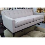 SOFA, contemporary design, sloping arms in light grey upholstery on ebonised legs,