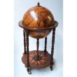 GLOBE COCKTAIL CABINET, in the form of an antique terrestrial globe with rising lid,