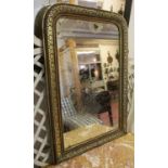 WALL MIRROR, late 19th century French ebonised and silvered wood with an arched top,