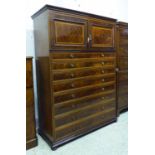 TALLBOY, Edwardian mahogany and parquetry banded, circa 1910 with two doors above seven drawers,