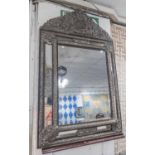 WALL MIRROR, 19th century Dutch repoussé metal and ebony moulded with bevelled rectangular plates,