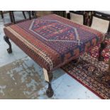 HEARTH STOOL, upholstered in vintage carpet raised on claw and ball cabriole supports,