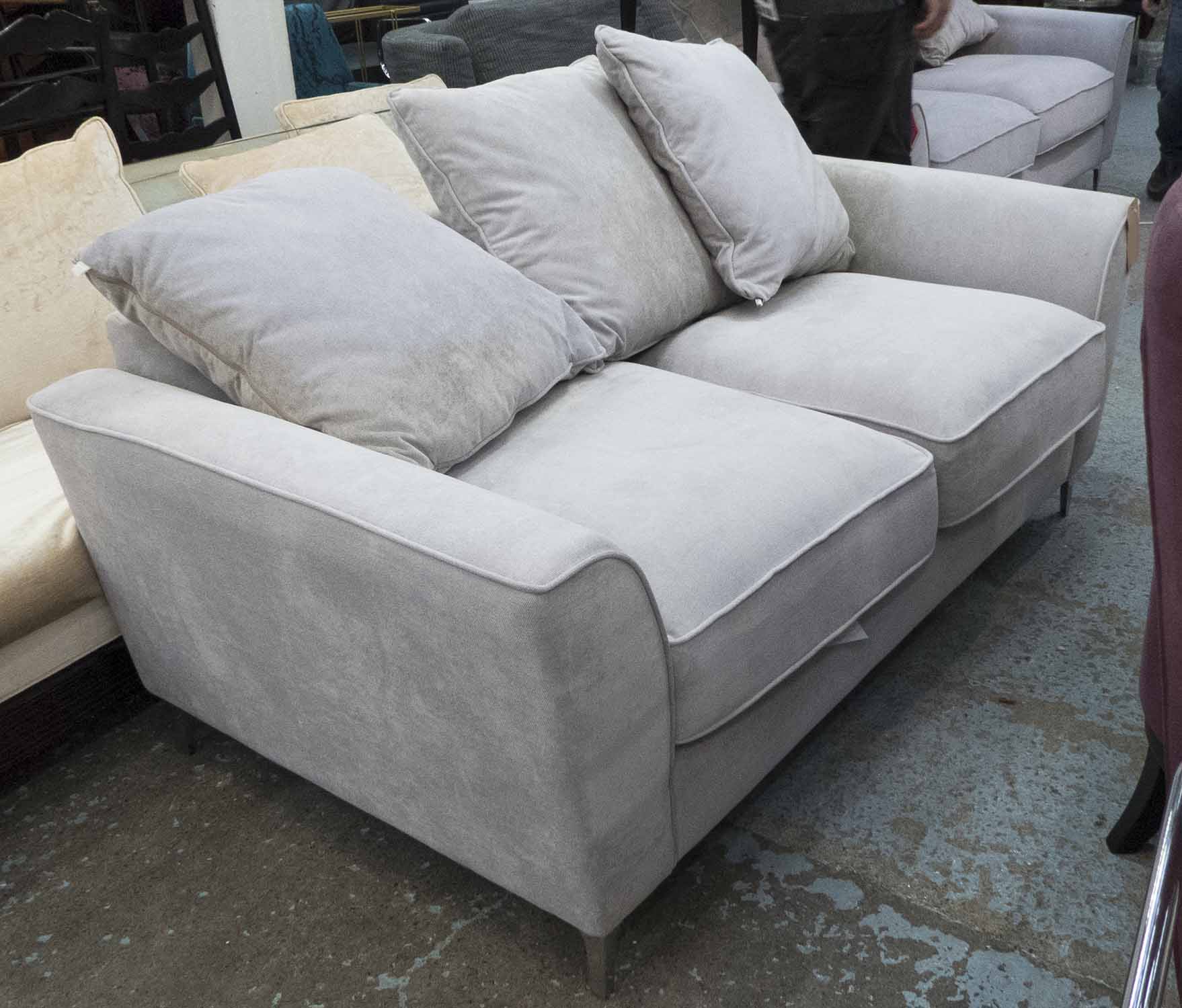 SOFA, two seater, in grey fabric on chromed metal supports plus three cushions, 176cm L.