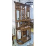 HALL STAND, early 20th century, oak with bevelled mirror panels, 92cm W x 186cm H.