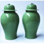 TEMPLE JARS, a pair, Chinese leaf green ceramic ginger jar form with lids, 53cm H.