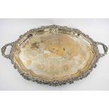 A LARGE ANTIQUE SILVER PLATED TRAY, circa 1880 with scroll Rococo border.