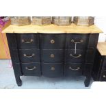 COMMODE, ebonised with natural top above three long drawers, 110cm W x 48cm D x 86cm H.