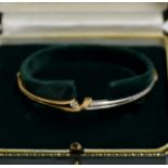 10K GOLD BANGLE WITH DIAMOND MOUNT IN FITTED CASE