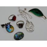 A LOT COMPRISING A MODERN SILVER PENDANT ON CHAIN, A SILVER BUTTERFLY WING PENDANT, A SILVER