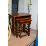 A NEST OF 3 MODERN STAINED OAK TABLES