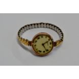 A VINTAGE ROLEX 9 CARAT GOLD CASED LADIES WRIST WATCH ON EXPANDING GILT BRACELET