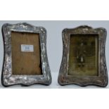 A PAIR OF ORNATE ART NOUVEAU STERLING SILVER MOUNTED EASEL PICTURE FRAMES - HALLMARKS INDISTINCT