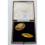 A 9 CARAT GOLD MOURNING BROOCH, TOGETHER WITH AN UNMARKED GOLD MOURNING BROOCH SET WITH A SMALL