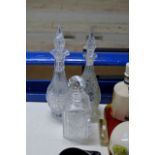 3 VARIOUS DECANTERS WITH STOPPERS