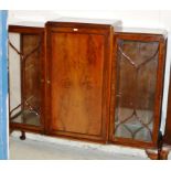 A MAHOGANY TRIPLE DOOR DISPLAY CABINET