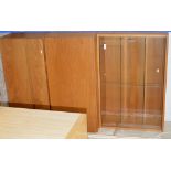 A TEAK GLASS FRONTED BOOKCASE WITH FALL FRONT UNIT BENEATH