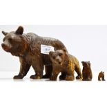 A GROUP OF 4 CARVED WOODEN BEAR ORNAMENTS IN THE STYLE OF BLACK FORREST