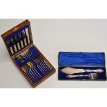 A CASED E.P.N.S. CARVING SET, TOGETHER WITH A CANTEEN OF E.P.N.S. CUTLERY