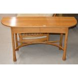 A 54½" ERCOL LIGHT OAK CONSOLE TABLE WITH 2 FITTED SIDE BY SIDE DRAWERS