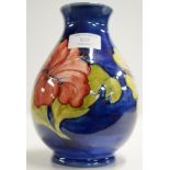 A 7½" MOORCROFT POTTERY VASE WITH ORIGINAL PAPER LABEL ON BASE