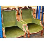 A PAIR OF MAHOGANY FRAMED WINGBACK ARM CHAIRS