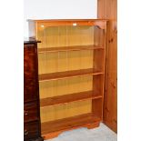 A MODERN PINE OPEN BOOKCASE