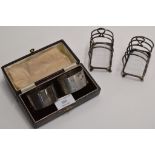 A BOXED PAIR OF INITIALLED STERLING SILVER NAPKIN RINGS, TOGETHER WITH A PAIR OF SMALL STERLING