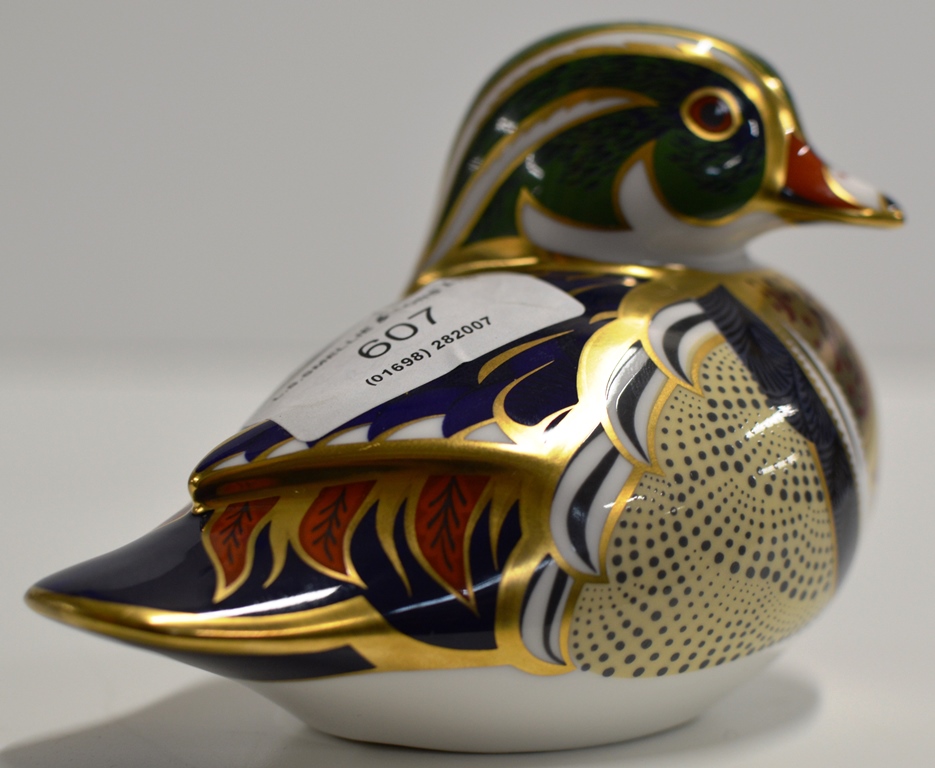 A ROYAL CROWN DERBY PORCELAIN PAPER WEIGHT MODELLED AS A CAROLINA DUCK