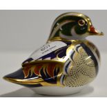 A ROYAL CROWN DERBY PORCELAIN PAPER WEIGHT MODELLED AS A CAROLINA DUCK
