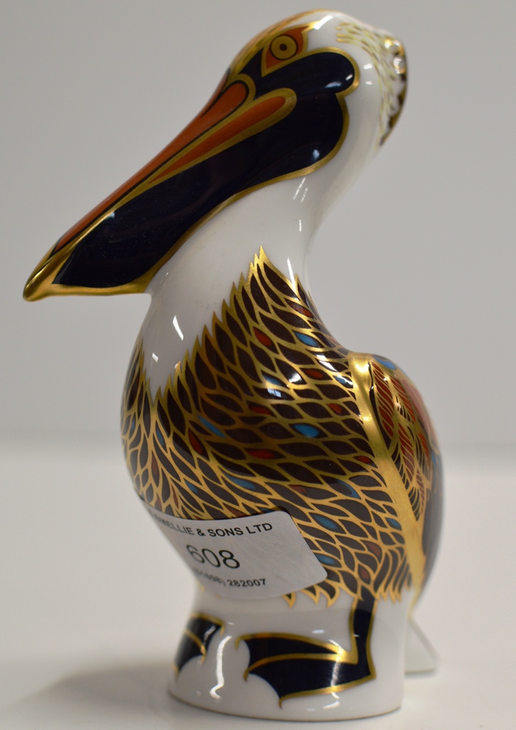 A ROYAL CROWN DERBY PORCELAIN PAPER WEIGHT MODELLED AS A BROWN PELICAN