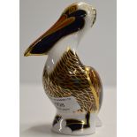 A ROYAL CROWN DERBY PORCELAIN PAPER WEIGHT MODELLED AS A BROWN PELICAN