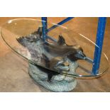 A MODERN GLASS TOP DOLPHIN DESIGN COFFEE TABLE