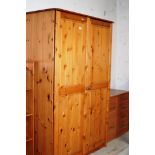 A LARGE MODERN PINE DOUBLE DOOR WARDROBE