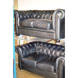 A 2 PIECE CHESTERFIELD BLACK LEATHER LOUNGE SUITE COMPRISING 2 X 2 SEATER SETTEES