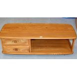 A 49" ERCOL LIGHT OAK 2 TIER TV UNIT WITH 2 STORAGE DRAWERS