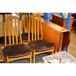 A TEAK GATE LEG TABLE WITH 4 CHAIRS