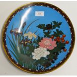 A 12" DIAMETER CHINESE CLOISONNÉ WALL CHARGER DECORATED WITH FLOWERS