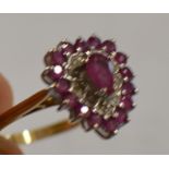 9 CARAT GOLD RUBY & DIAMOND CHIP SET HEART SHAPED RING - APPROXIMATE WEIGHT = 3.5 GRAMS