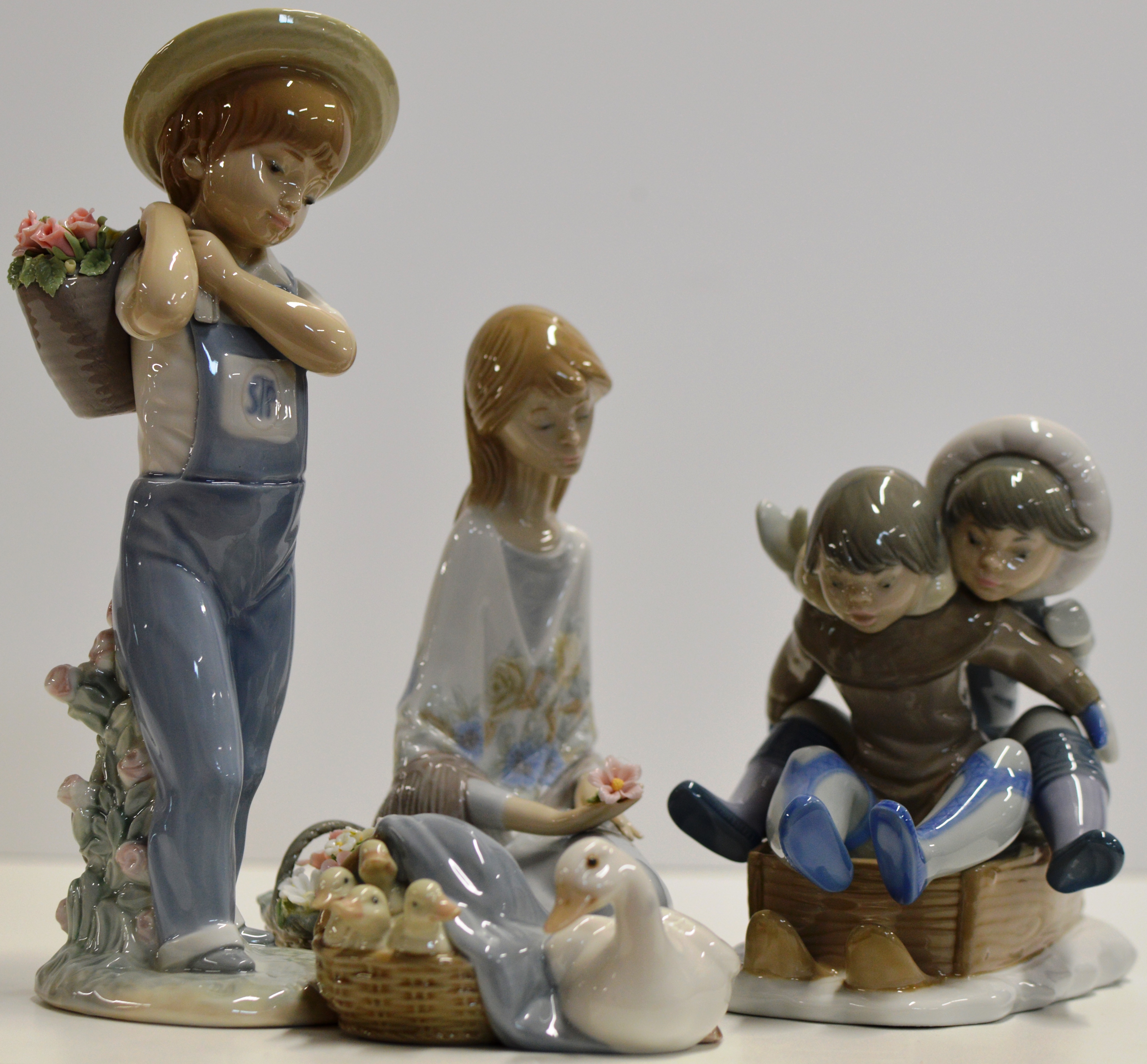 GROUP OF 4 LLADRO PORCELAIN FIGURINE ORNAMENTS - HOLD ON 5665, BOY GATHERING FLOWERS 1286, FLOWER