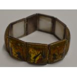 EARLY 20TH CENTURY EASTERN WHITE METAL BRACELET WITH HAND PAINTED MOTHER OF PEARL PANELS DECORATED